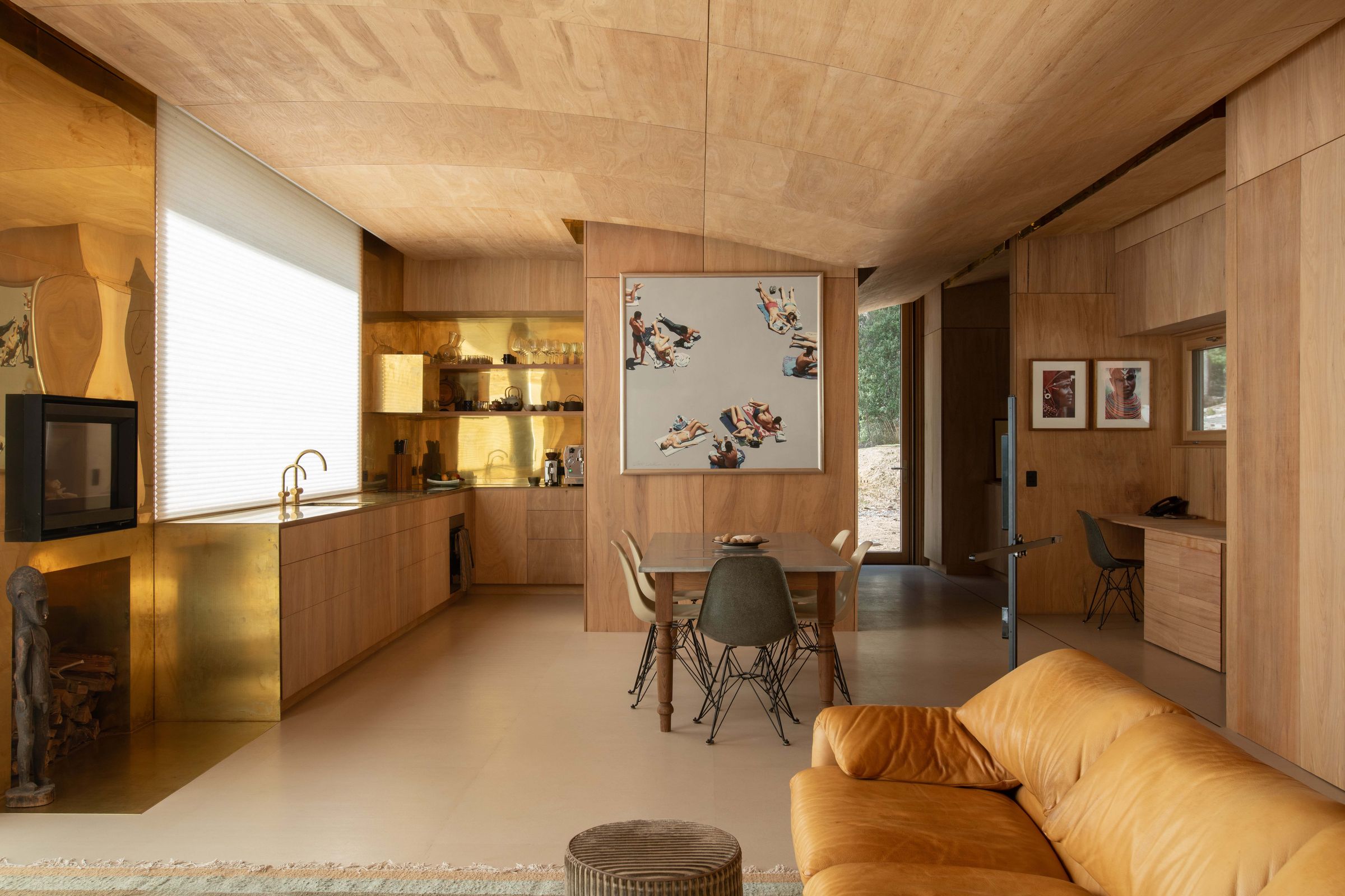 Mountain House kitchen with brass benchtop, brass tapware, timber joinery, and appliances